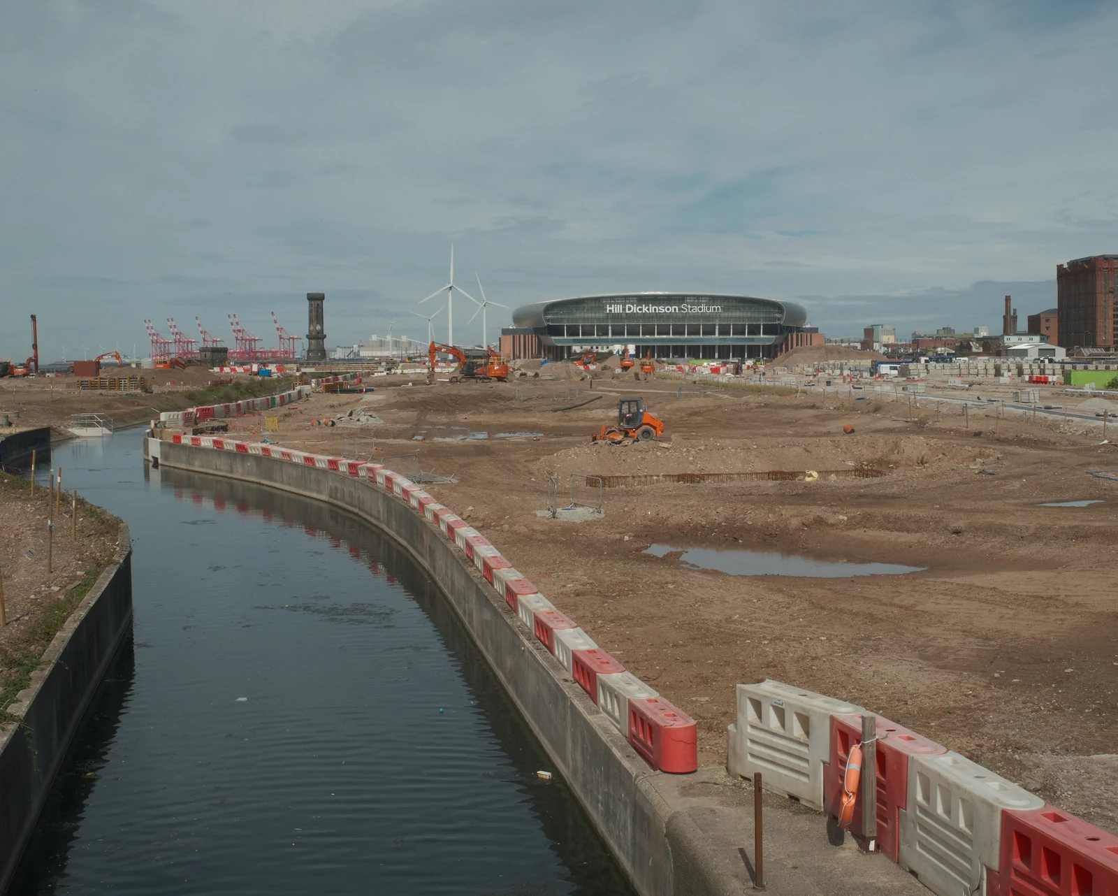 Victoria Tower to the left of Bramley Moore (Hill Dickinson Stadium), across dock water and building works
