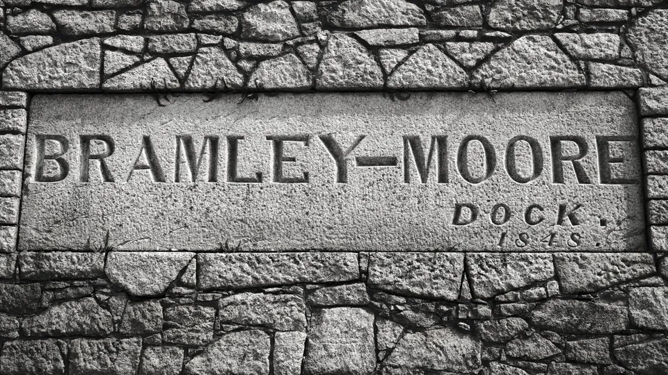 Photograph: Carved Bramley-Moore Dock lettering in textured stone.